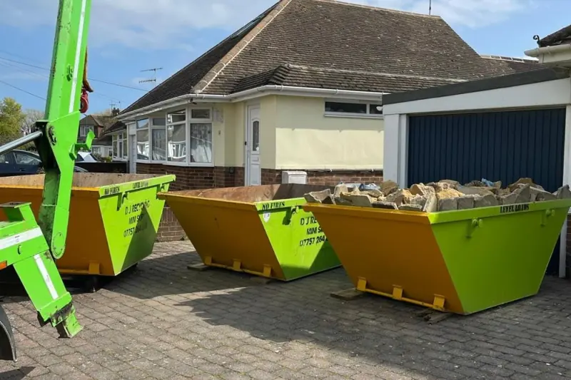 Mini skips lined up on a driveway, D J Recycling, West Sussex