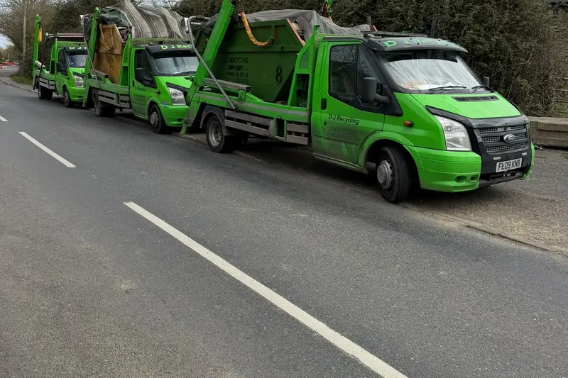 D J Recycling skip lorries parked roadside